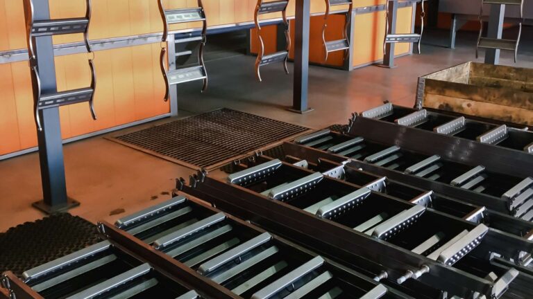 anodizing aluminum in michigan ladders lined up on cool rack after powder coating