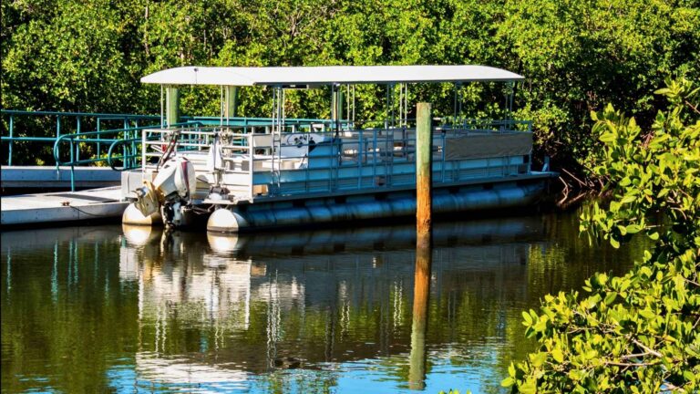 pontoon boat on lake front home property being prepared for marine powder coating